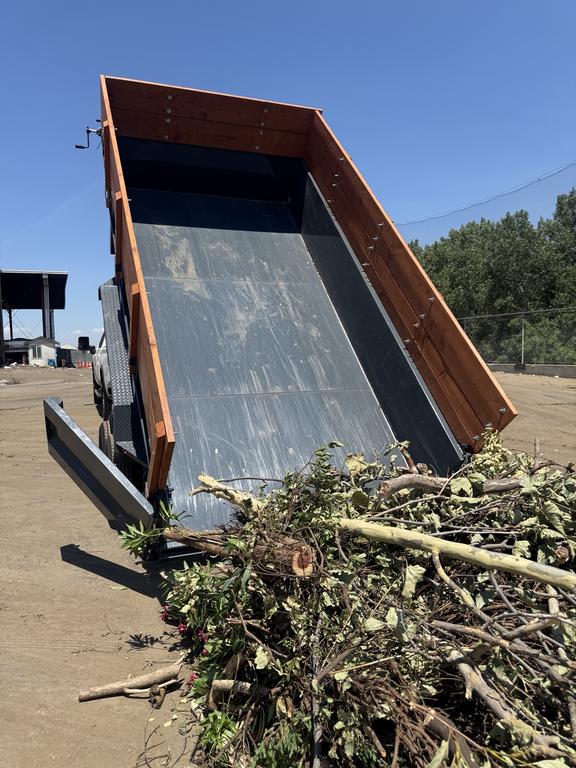 Sutter Rentals dump trailer unloading yard debris